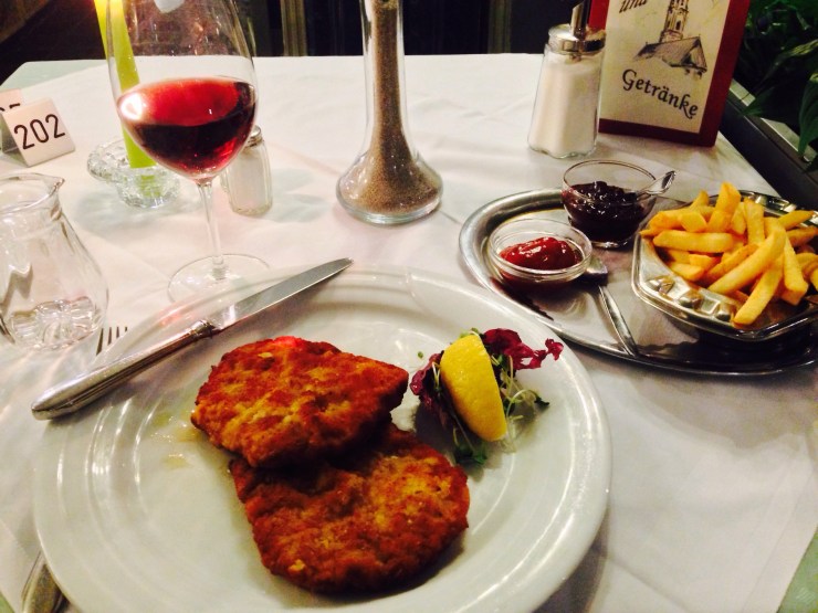 Wiener schnitzel with pork, fries and cranberry sauce. Along with red wine, of course. 