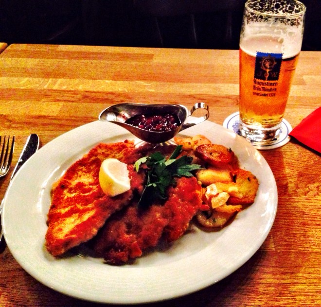 My delicious meal of bread crumbed schnitzel of vealsaddle with roasted potatoes and Augustiner Edelsoff beer. 